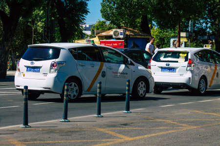 Seville Spain September 18, 2021 Taxi driving through the streets of Seville during the coronavirus outbreak hitting Spain, wearing a mask is mandatoryのeditorial素材