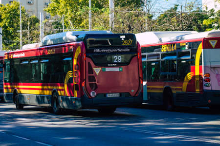 Seville Spain September 18, 2021 Bus driving through the streets of Seville during the coronavirus outbreak hitting Spain, wearing a mask is mandatoryのeditorial素材