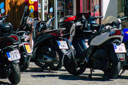 Seville Spain September 18, 2021 Motorcycles parked in the streets of Seville, an emblematic city and the capital of the region of Andalusia, in the south of Spainのeditorial素材