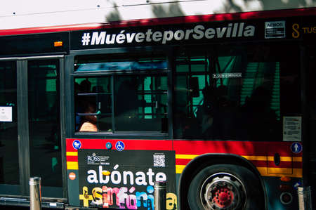Seville Spain September 18, 2021 Bus driving through the streets of Seville during the coronavirus outbreak hitting Spain, wearing a mask is mandatoryのeditorial素材
