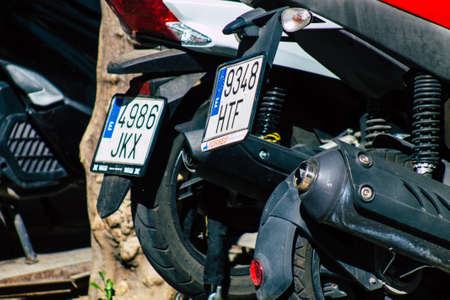 Seville Spain September 18, 2021 Motorcycles parked in the streets of Seville, an emblematic city and the capital of the region of Andalusia, in the south of Spainのeditorial素材