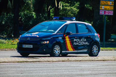 Seville Spain September 22, 2021 Police car patrolling in the streets of Seville during the coronavirus outbreak hitting Spain, wearing a mask in the street is not mandatoryのeditorial素材