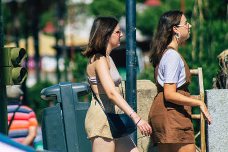 Seville Spain September 18, 2021 Pedestrians walking in the street during the coronavirus outbreak hitting Spain, wearing a mask is not mandatory but most of people wear itのeditorial素材