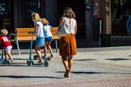 Seville Spain September 18, 2021 Pedestrians walking in the street during the coronavirus outbreak hitting Spain, wearing a mask is not mandatory but most of people wear itのeditorial素材
