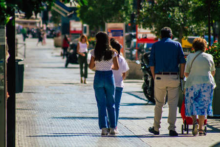Seville Spain September 18, 2021 Pedestrians walking in the street during the coronavirus outbreak hitting Spain, wearing a mask is not mandatory but most of people wear itのeditorial素材