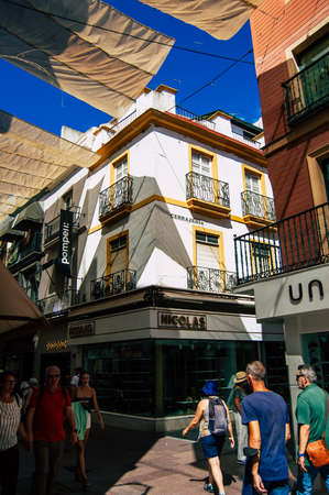 Seville Spain September 18, 2021 Pedestrians walking in the street during the coronavirus outbreak hitting Spain, wearing a mask is not mandatory but most of people wear itのeditorial素材