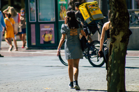 Seville Spain September 18, 2021 Pedestrians walking in the street during the coronavirus outbreak hitting Spain, wearing a mask is not mandatory but most of people wear itのeditorial素材