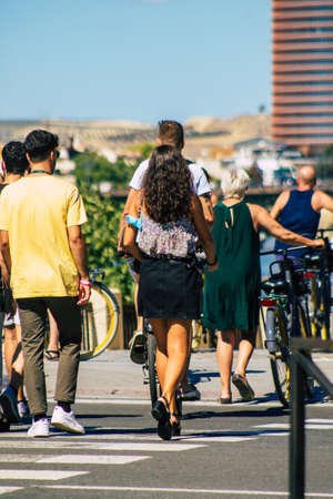 Seville Spain September 18, 2021 Pedestrians walking in the street during the coronavirus outbreak hitting Spain, wearing a mask is not mandatory but most of people wear itのeditorial素材