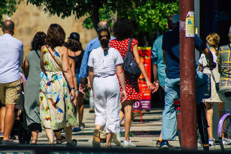 Seville Spain September 18, 2021 Pedestrians walking in the street during the coronavirus outbreak hitting Spain, wearing a mask is not mandatory but most of people wear itのeditorial素材