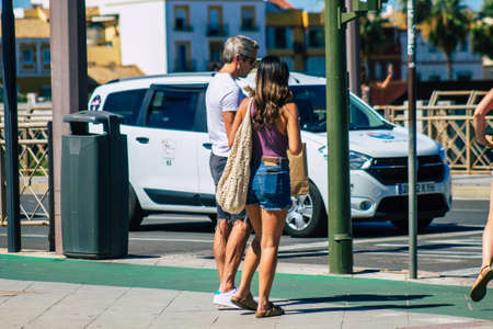 Seville Spain September 18, 2021 Pedestrians walking in the street during the coronavirus outbreak hitting Spain, wearing a mask is not mandatory but most of people wear itのeditorial素材