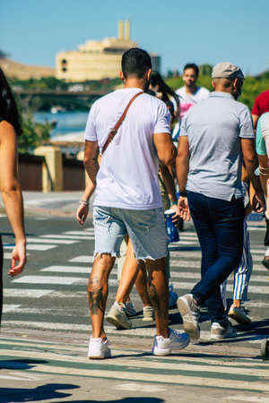 Seville Spain September 18, 2021 Pedestrians walking in the street during the coronavirus outbreak hitting Spain, wearing a mask is not mandatory but most of people wear itのeditorial素材