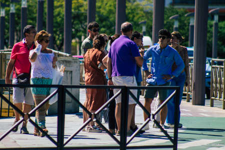 Seville Spain September 18, 2021 Pedestrians walking in the street during the coronavirus outbreak hitting Spain, wearing a mask is not mandatory but most of people wear itのeditorial素材