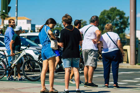 Seville Spain September 18, 2021 Pedestrians walking in the street during the coronavirus outbreak hitting Spain, wearing a mask is not mandatory but most of people wear itのeditorial素材