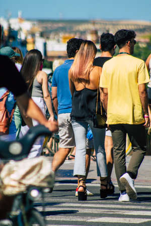 Seville Spain September 18, 2021 Pedestrians walking in the street during the coronavirus outbreak hitting Spain, wearing a mask is not mandatory but most of people wear itのeditorial素材