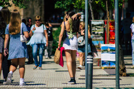 Seville Spain September 18, 2021 Pedestrians walking in the street during the coronavirus outbreak hitting Spain, wearing a mask is not mandatory but most of people wear itのeditorial素材