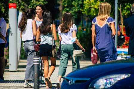 Seville Spain September 18, 2021 Pedestrians walking in the street during the coronavirus outbreak hitting Spain, wearing a mask is not mandatory but most of people wear itのeditorial素材