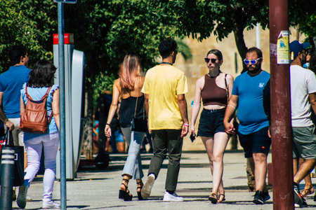 Seville Spain September 18, 2021 Pedestrians walking in the street during the coronavirus outbreak hitting Spain, wearing a mask is not mandatory but most of people wear itのeditorial素材