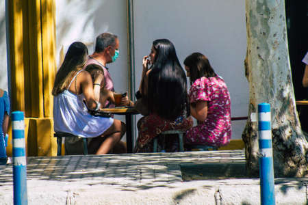 Seville Spain September 18, 2021 Pedestrians walking in the street during the coronavirus outbreak hitting Spain, wearing a mask is not mandatory but most of people wear itのeditorial素材