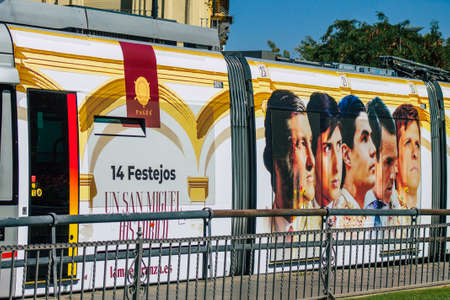 Seville Spain September 04, 2021 Modern electric tram for passengers rolling through the streets of Seville during the coronavirus outbreak hitting Spain, wearing a mask is mandatoryのeditorial素材