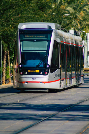 Seville Spain September 04, 2021 Modern electric tram for passengers rolling through the streets of Seville during the coronavirus outbreak hitting Spain, wearing a mask is mandatoryのeditorial素材