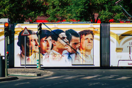 Seville Spain September 04, 2021 Modern electric tram for passengers rolling through the streets of Seville during the coronavirus outbreak hitting Spain, wearing a mask is mandatoryのeditorial素材