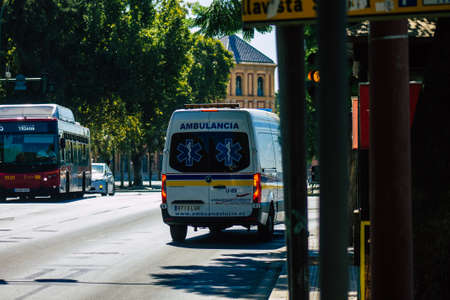 Seville Spain September 04, 2021 Ambulance driving through the streets of Seville during the coronavirus outbreak hitting Spain, wearing a mask is mandatoryのeditorial素材