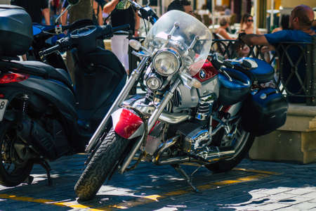 Seville Spain September 04, 2021 Motorcycles parked in the streets of Seville, an emblematic city and the capital of the region of Andalusia, in the south of Spainのeditorial素材