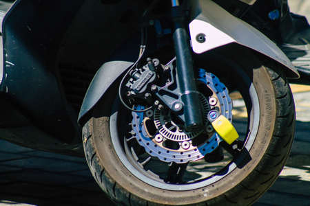 Seville Spain September 04, 2021 Motorcycles parked in the streets of Seville, an emblematic city and the capital of the region of Andalusia, in the south of Spainのeditorial素材
