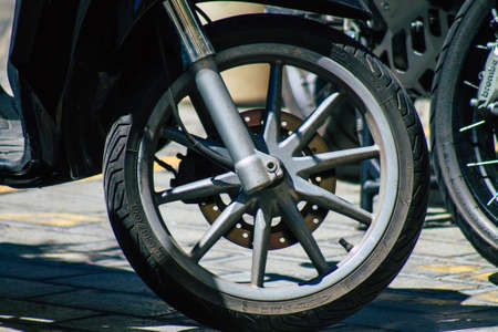 Seville Spain September 04, 2021 Motorcycles parked in the streets of Seville, an emblematic city and the capital of the region of Andalusia, in the south of Spainのeditorial素材
