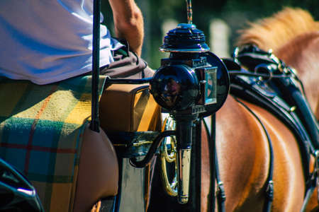Seville Spain September 04, 2021 Horse drawn carriage ride through the streets of Seville during the coronavirus outbreak hitting Spain, wearing a mask is mandatoryのeditorial素材