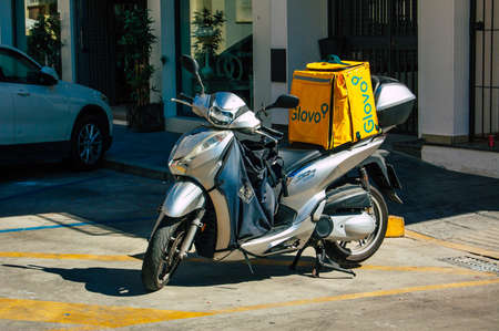 Seville Spain September 04, 2021 Scooters parked in the streets of Seville, an emblematic city and the capital of the region of Andalusia, in the south of Spainのeditorial素材