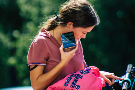 Seville Spain September 18, 2021 Pedestrians walking in the street during the coronavirus outbreak hitting Spain, wearing a mask is not mandatory but most of people wear itのeditorial素材