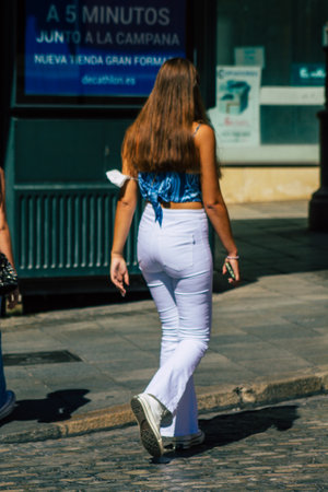 Seville Spain September 18, 2021 Pedestrians walking in the street during the coronavirus outbreak hitting Spain, wearing a mask is not mandatory but most of people wear itのeditorial素材