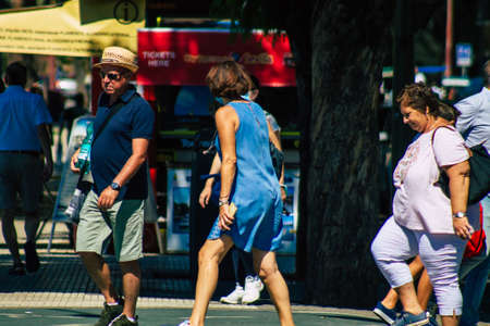 Seville Spain September 18, 2021 Pedestrians walking in the street during the coronavirus outbreak hitting Spain, wearing a mask is not mandatory but most of people wear itのeditorial素材