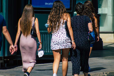 Seville Spain September 18, 2021 Pedestrians walking in the street during the coronavirus outbreak hitting Spain, wearing a mask is not mandatory but most of people wear itのeditorial素材