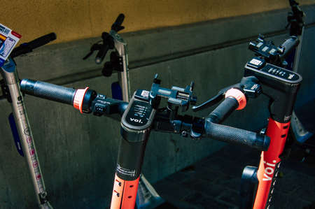 Seville Spain September 04, 2021 Electric scooter to rent parked in the streets of Seville, operating with a small utility internal combustion engines and a deck in the centerのeditorial素材