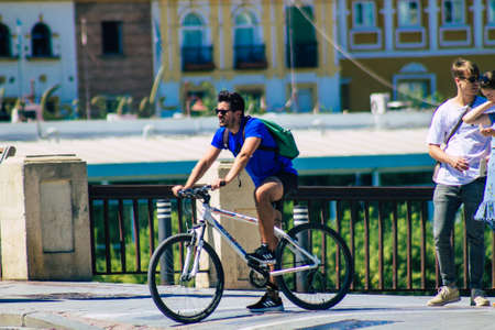 Seville Spain September 04, 2021 People rolling with a bicycle in the streets of Seville, an emblematic city and the capital of the region of Andalusia, in the south of Spainのeditorial素材