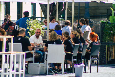 Seville Spain September 18, 2021 Pedestrians walking in the street during the coronavirus outbreak hitting Spain, wearing a mask is not mandatory but most of people wear itのeditorial素材