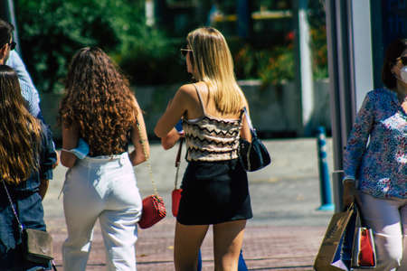 Seville Spain September 18, 2021 Pedestrians walking in the street during the coronavirus outbreak hitting Spain, wearing a mask is not mandatory but most of people wear itのeditorial素材