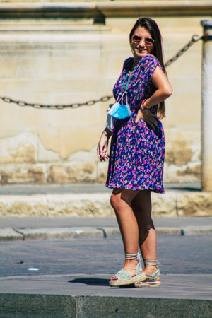Seville Spain September 18, 2021 Pedestrians walking in the street during the coronavirus outbreak hitting Spain, wearing a mask is not mandatory but most of people wear itのeditorial素材