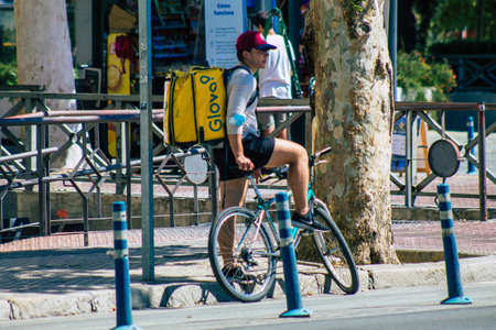 Seville Spain September 18, 2021 People rolling with a bicycle in the streets of Seville, an emblematic city and the capital of the region of Andalusia, in the south of Spainのeditorial素材