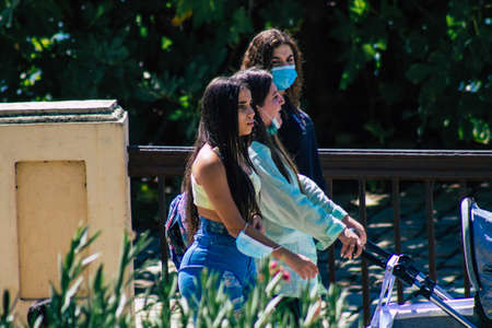 Seville Spain September 18, 2021 Pedestrians walking in the street during the coronavirus outbreak hitting Spain, wearing a mask is not mandatory but most of people wear itのeditorial素材