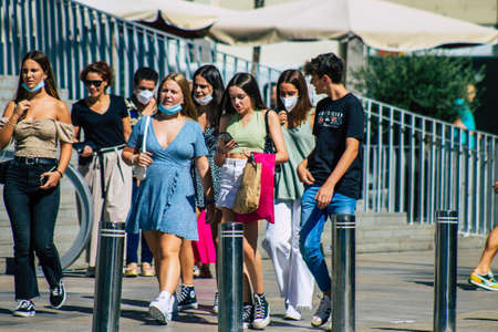 Seville Spain September 18, 2021 Pedestrians walking in the street during the coronavirus outbreak hitting Spain, wearing a mask is not mandatory but most of people wear itのeditorial素材