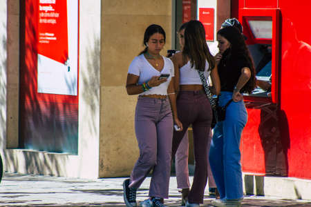 Seville Spain September 18, 2021 Pedestrians walking in the street during the coronavirus outbreak hitting Spain, wearing a mask is not mandatory but most of people wear itのeditorial素材