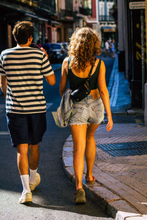 Seville Spain September 18, 2021 Pedestrians walking in the street during the coronavirus outbreak hitting Spain, wearing a mask is not mandatory but most of people wear itのeditorial素材