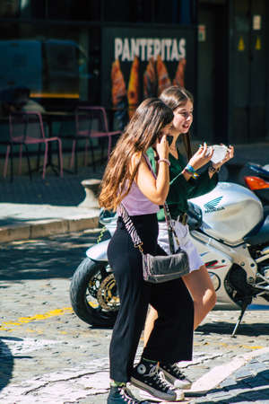Seville Spain September 18, 2021 Pedestrians walking in the street during the coronavirus outbreak hitting Spain, wearing a mask is not mandatory but most of people wear itのeditorial素材