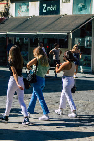 Seville Spain September 18, 2021 Pedestrians walking in the street during the coronavirus outbreak hitting Spain, wearing a mask is not mandatory but most of people wear itのeditorial素材