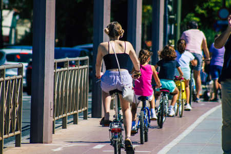 Seville Spain September 18, 2021 People rolling with a bicycle in the streets of Seville, an emblematic city and the capital of the region of Andalusia, in the south of Spainのeditorial素材