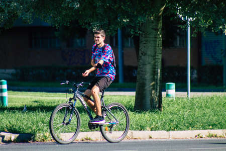Seville Spain September 18, 2021 People rolling with a bicycle in the streets of Seville, an emblematic city and the capital of the region of Andalusia, in the south of Spainのeditorial素材