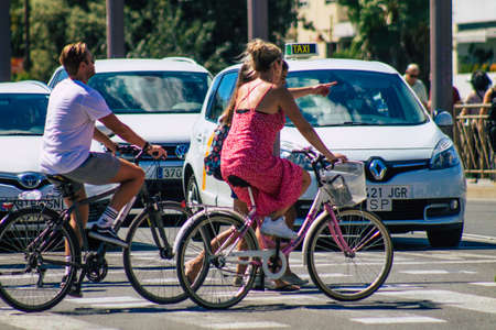 Seville Spain September 18, 2021 People rolling with a bicycle in the streets of Seville, an emblematic city and the capital of the region of Andalusia, in the south of Spainのeditorial素材